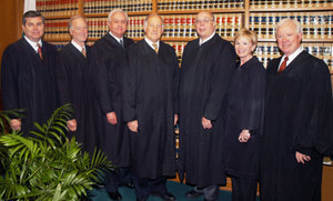 Seven appellate justices posing together in photo
