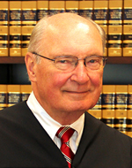 Raymond J. Ikola, Associate Justice 